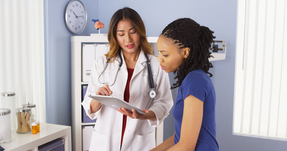 adult-patient-reviewing-health-information-with-healthcare-provider
