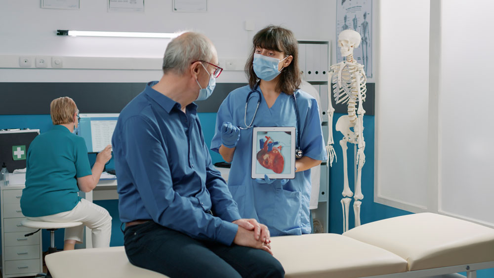 older-adult-patient-discussing-health-information-with-clinician