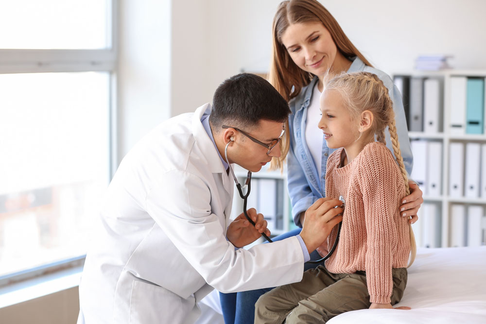 pediatric-patient-and-parent-with-healthcare-provider-during-clinical-visit