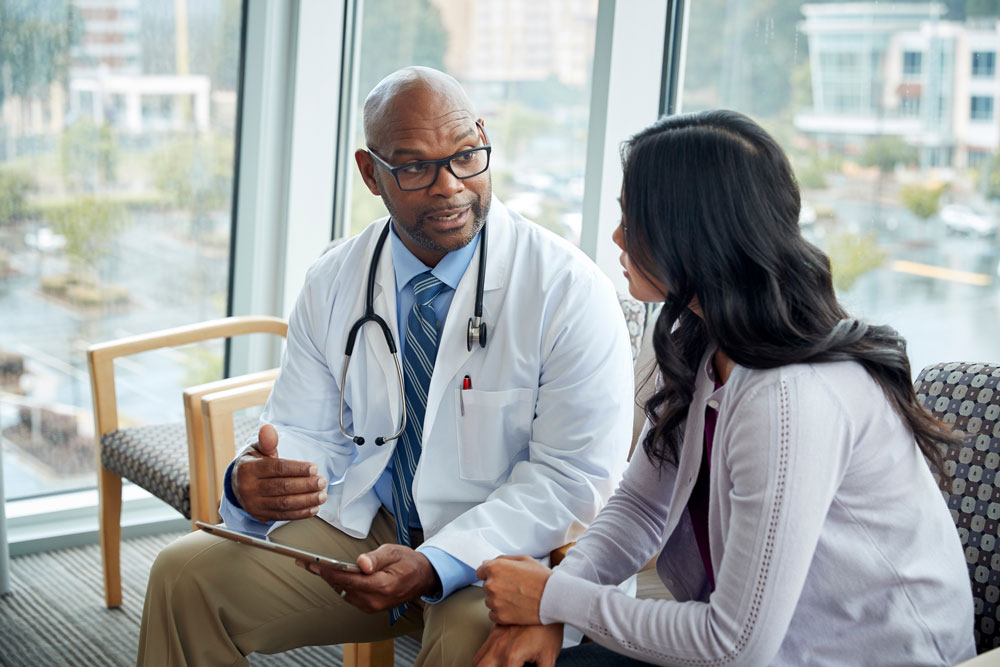 healthcare-provider-discussing-patient-reported-outcome-information-with-patient