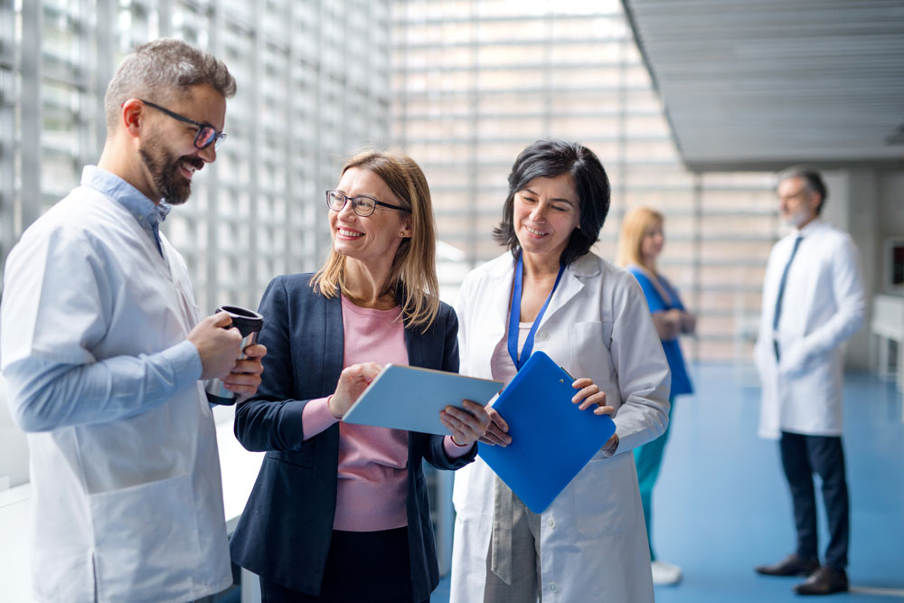 healthcare-professionals-reviewing-patient-reported-outcomes-data-and-discussing-clinical-care-decisions