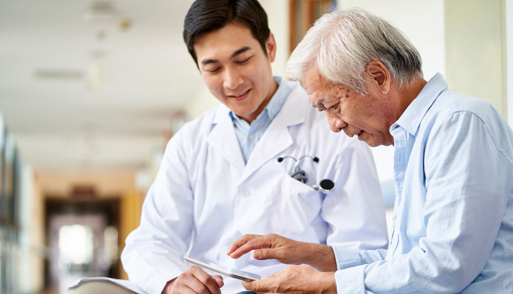Patient-completing-an-NIH-Toolbox-assessment-on-a-tablet-with-clinician-guidance